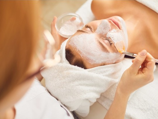 a woman doing facial service